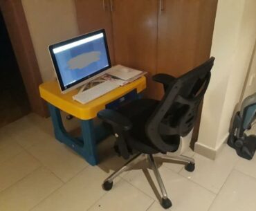 At one point I had this. A plastic children desk, all in one HP, e-waste mouse and keyboard, a couple of books and an A4 paper as a mousepad. Next to a closet.