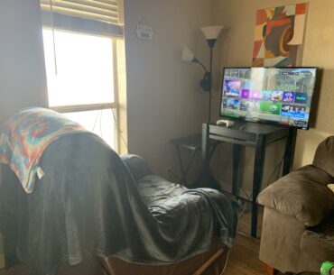 My gf’s gaming corner. Complete with a free TV with no legs or mount, a lamp serving as a headset stand, and a 10 year old lazy boy. It’s literally perfect