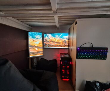 Battlestation under bed in tiny house.